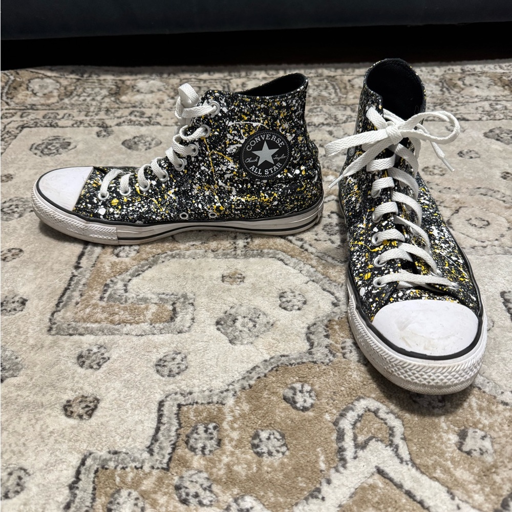 Converse High Tops in black with gray, white and yellow paint splatter